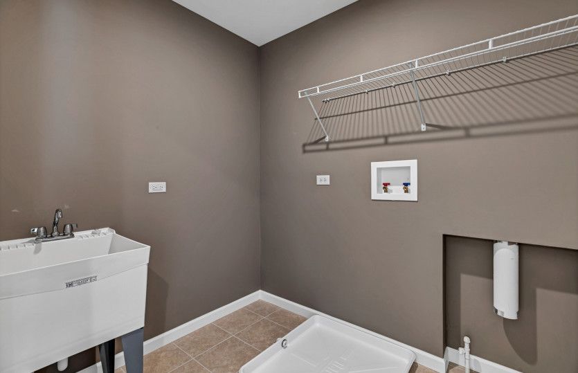 Laundry Room with Shelving and Utility Sink