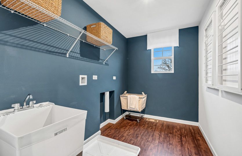 Laundry Room with Utility Sink and Built-In Shelving