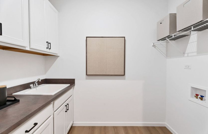 Laundry Room with Utility Sink and Cabinets