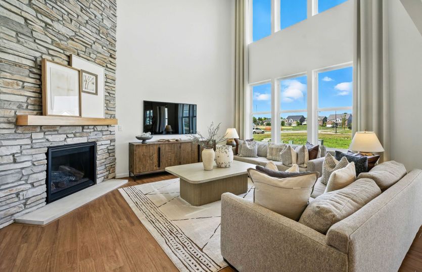 Spacious gathering room with cozy fireplace