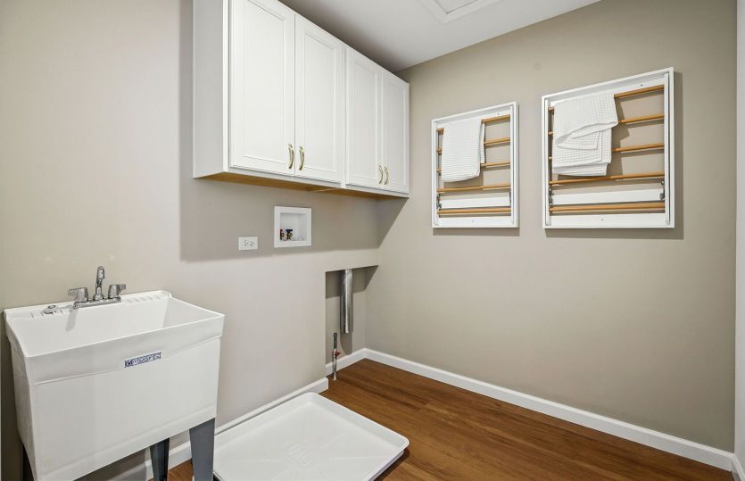 Laundry room with upper cabinet storage