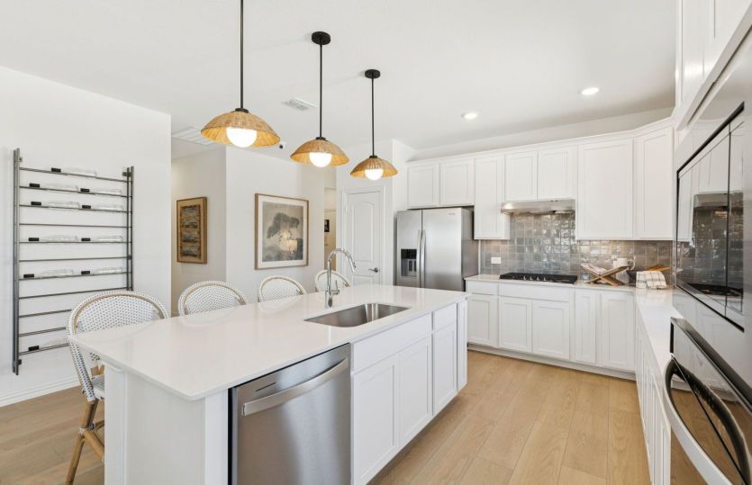 Spacious kitchen with pendant lighting