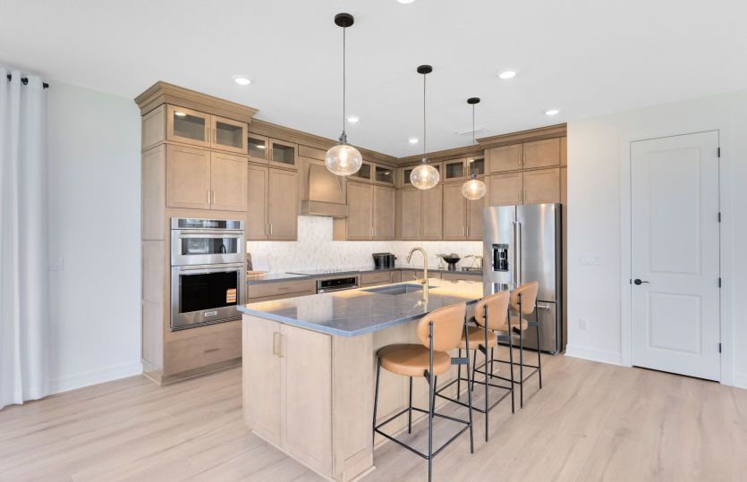 Sleek, open kitchen with island seating