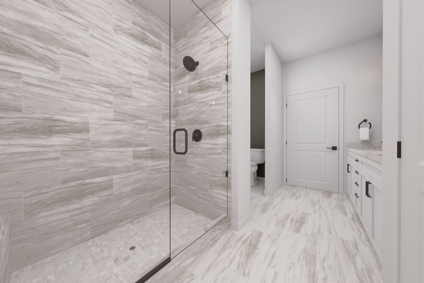 Luxurious Owner's Bath with Frameless Walk-In Shower