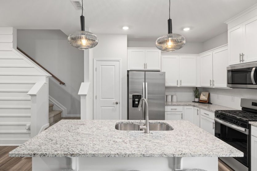 Stunning Kitchen with Seating at Island keeping the Cook Connected - Model Representation