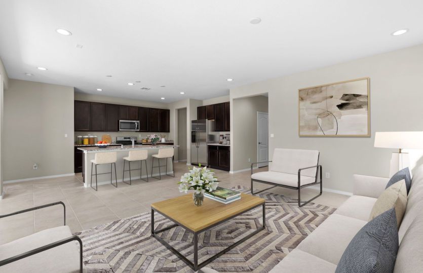 Open living concept with gathering room, kitchen, and cafe.