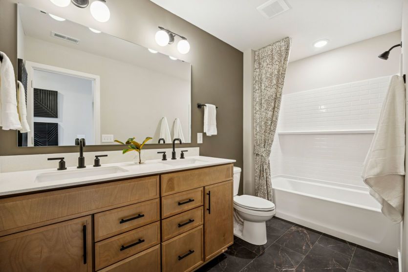 Stylish shared bathroom upstairs.