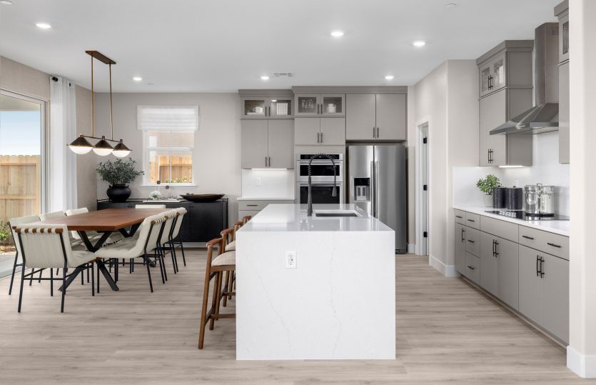 Kitchen with large waterfall edge kitchen island