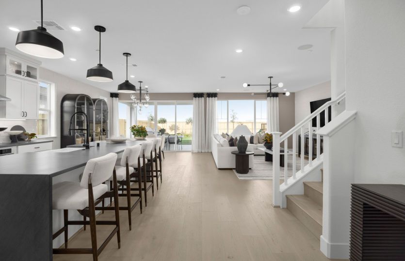 Kitchen with large central island open to main gathering space