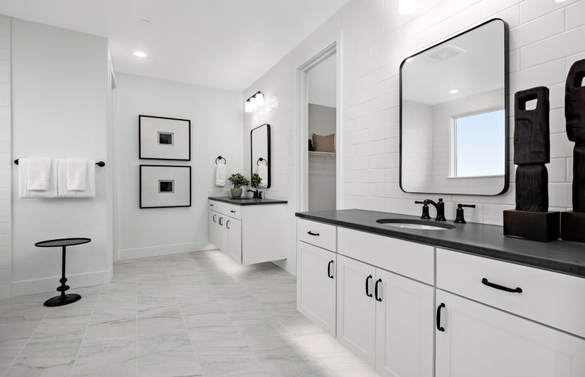 Luxurious owner's bathroom with separate vanities