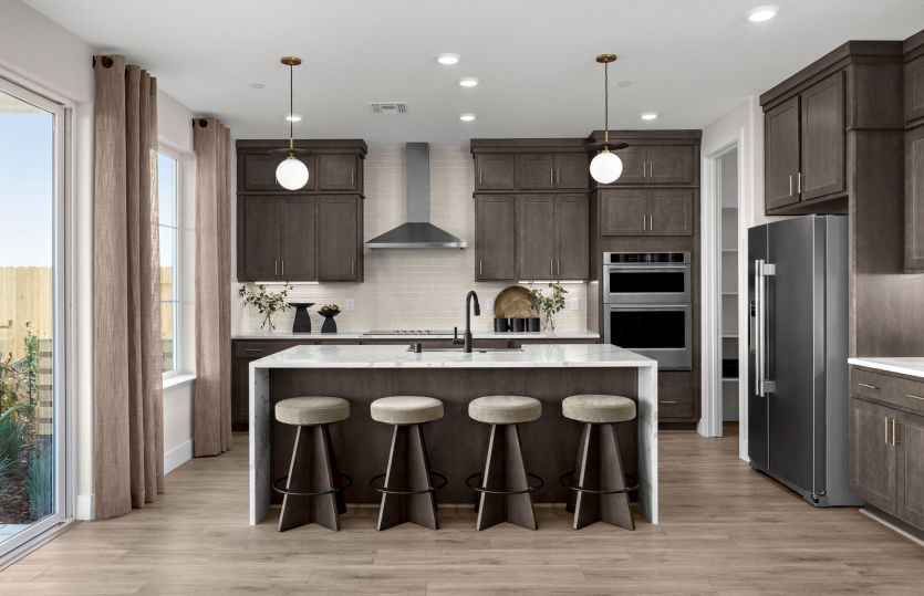 Kitchen with large waterfall edge island