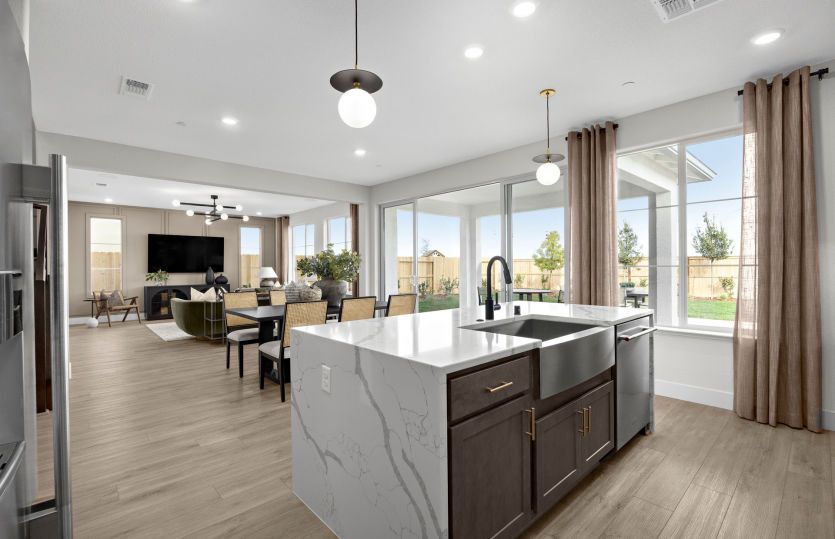 Kitchen open to main living area and outdoor access