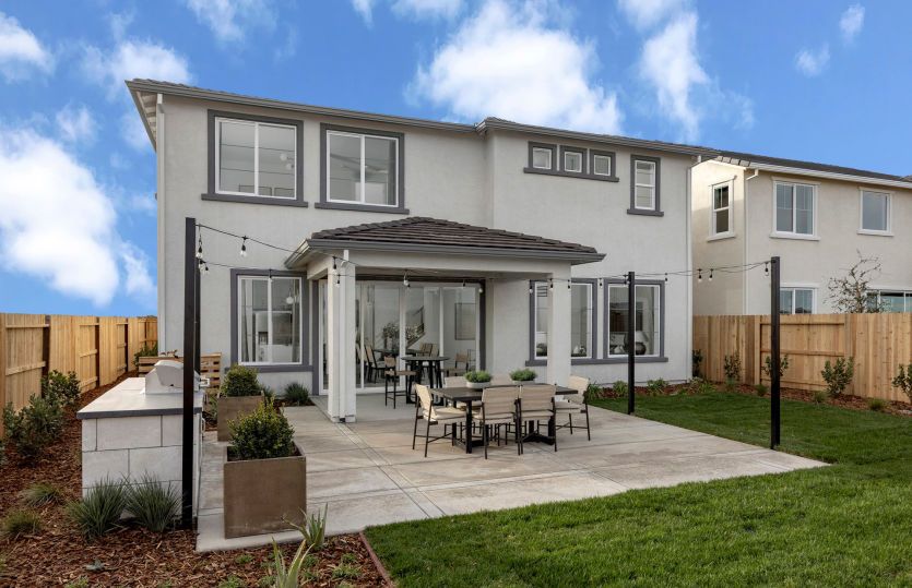 Spacious backyard with covered patio and built-in outdoor kitchen