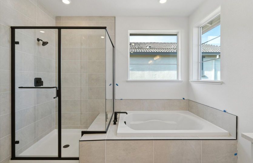 Primary bath with separate tub and walk-in shower