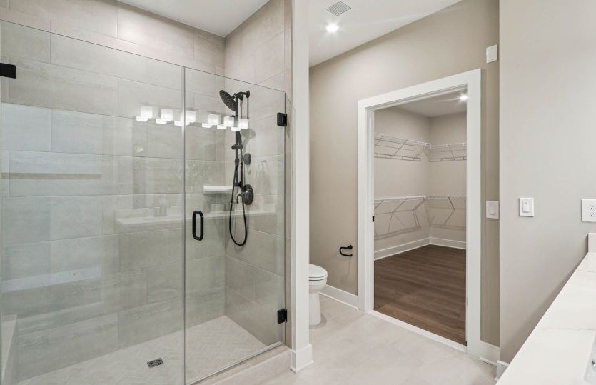 Luxurious Owner's Bath with Frameless Glass Shower