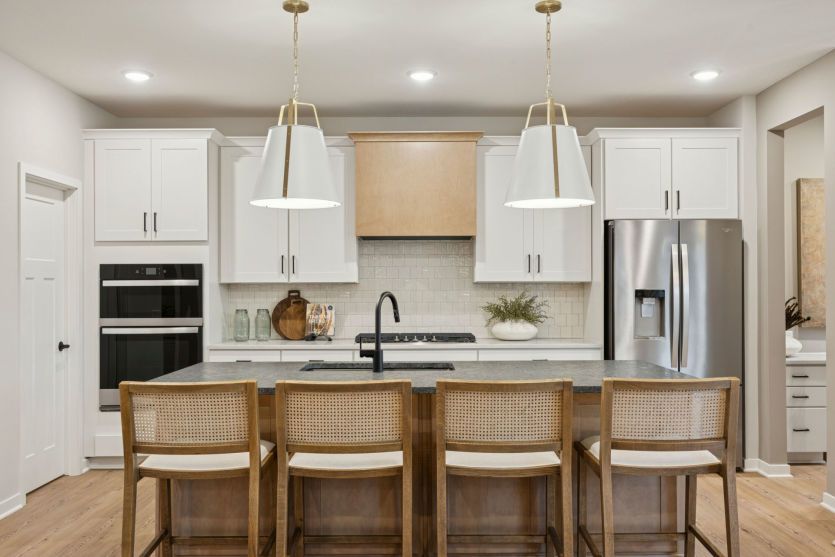 A chef’s dream kitchen with sleek appliances, a spacious island, and elegant finishes.