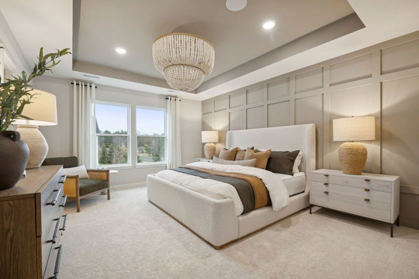 Relax in this serene primary suite with luxurious finishes and ample space to unwind.