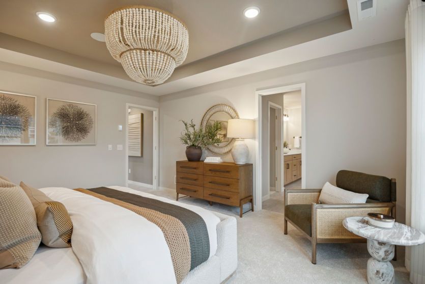 Relax in this serene primary suite with luxurious finishes and ample space to unwind.