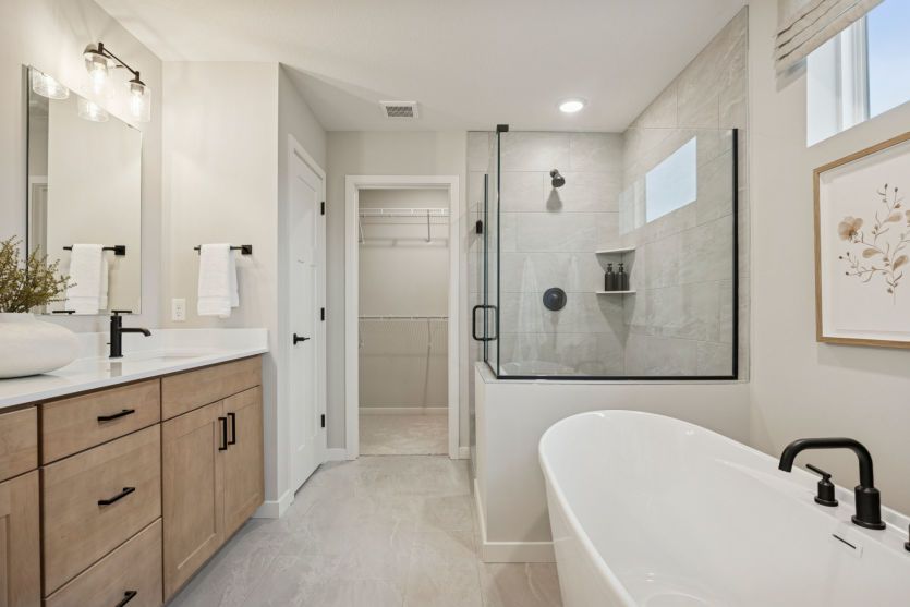 Indulge in spa-like luxury with a soaking tub, walk-in shower, and dual vanities.