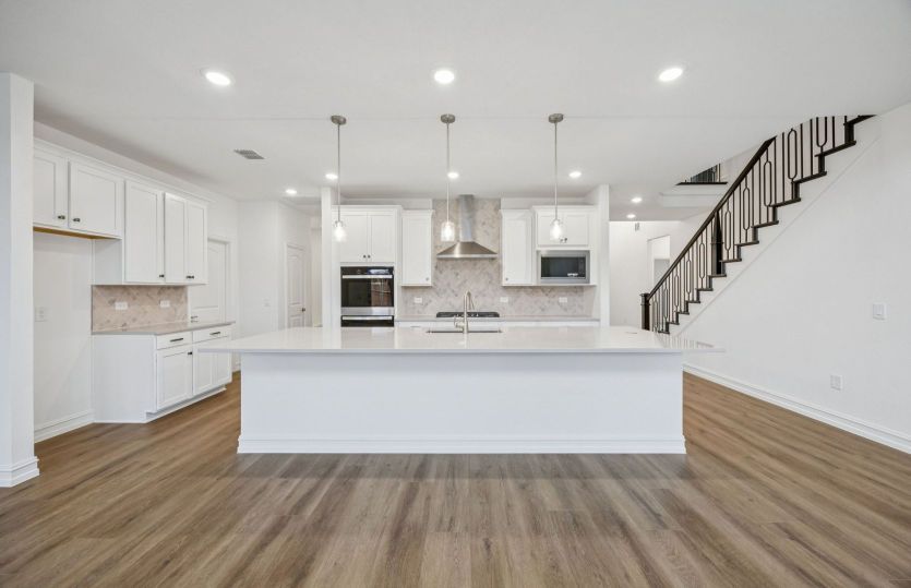 Spacious, eat-in island kitchen *photos depict options and features that may not be available
