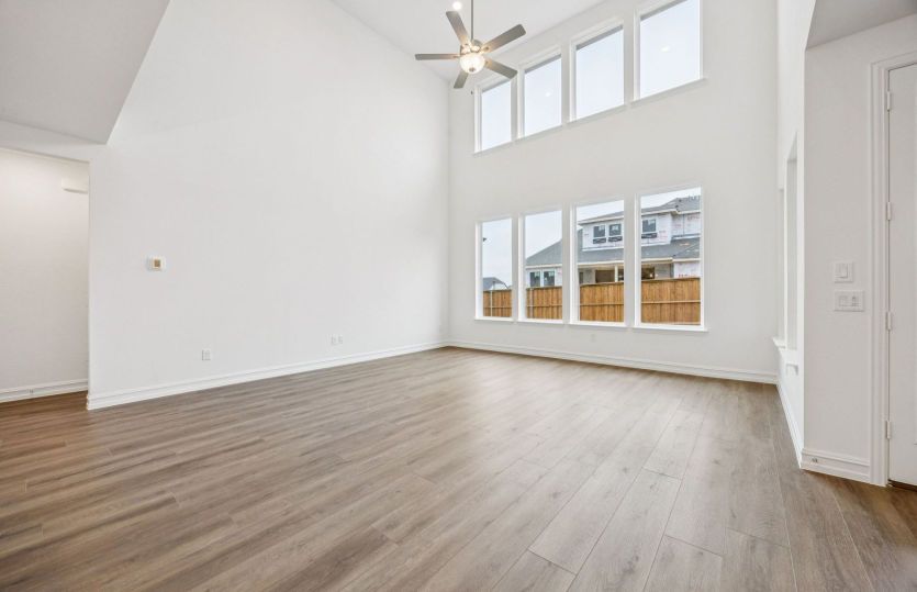 Gathering room offering natural light and soaring ceilings *photos depict options and features that may not be available