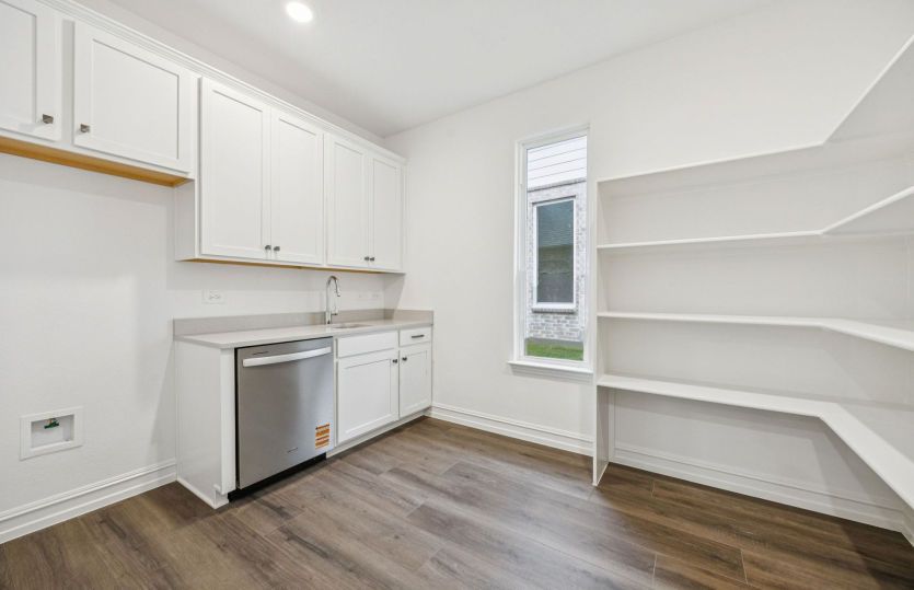 Spacious laundry and pantry area *photos depict options and features that may not be available