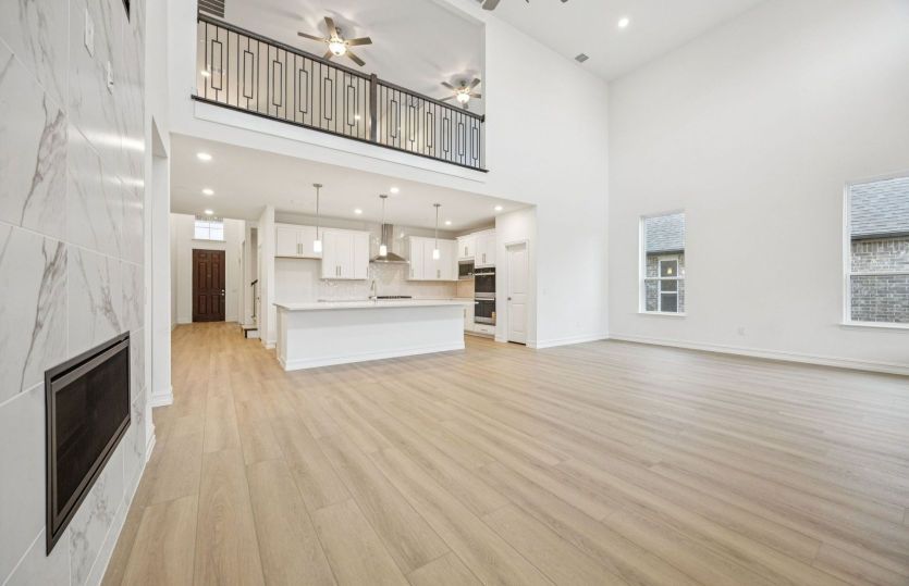 Open concept living area with two-story ceilings