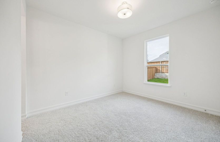 Spacious additional bedroom ideal for family or visitors.