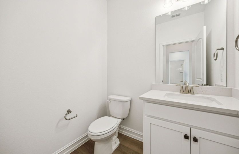 Sleek powder bathroom layout offering comfort and convenience.
