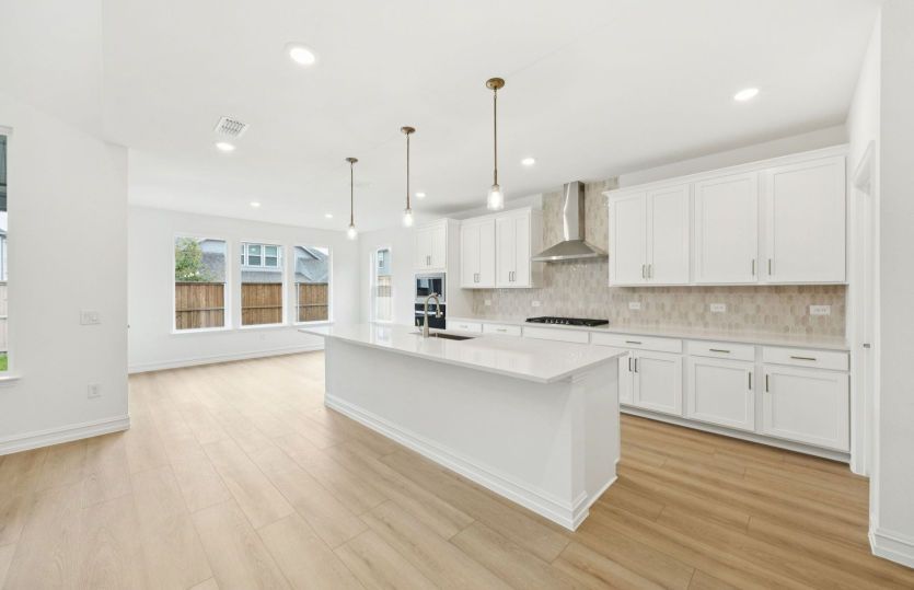 Spacious kitchen with open-concept design *photos may depict options and features that aren't available