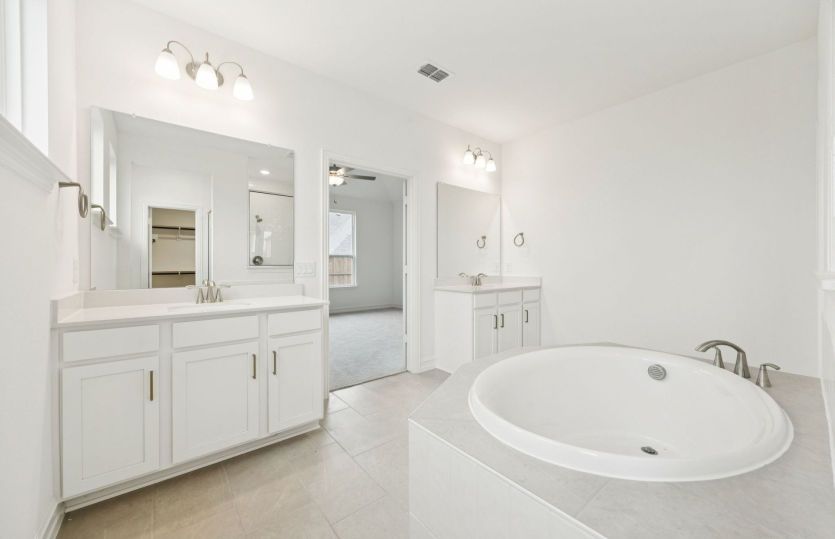 Owner's bath with separate tub and shower *photos may depict options and features that aren't available