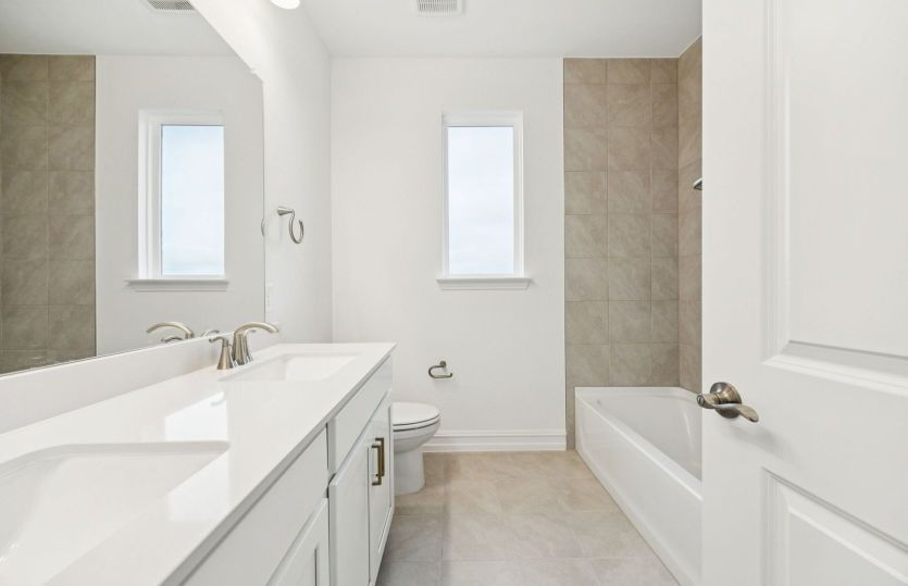 Spacious secondary bathroom *photos may depict options and features that aren't available