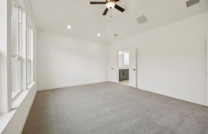 Owner's suite with large windows *photos may depict options and features that aren't available