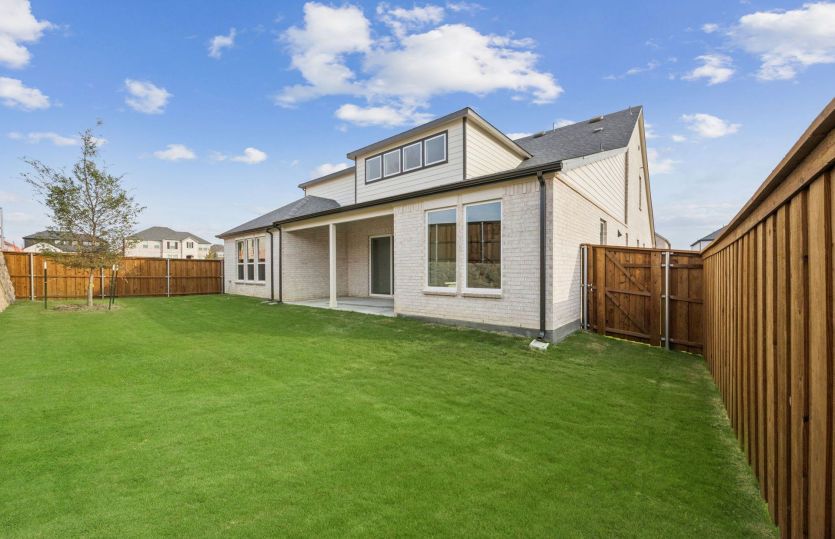 Covered patio and fenced-in backyard *photos may depict options and features that aren't available