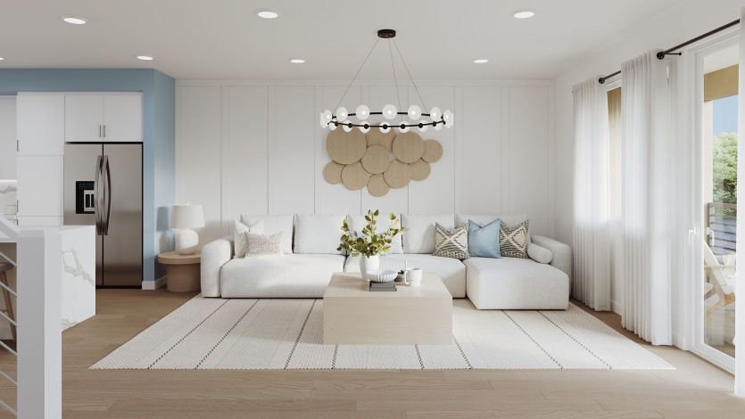 Gathering room with sliding glass door and balcony access