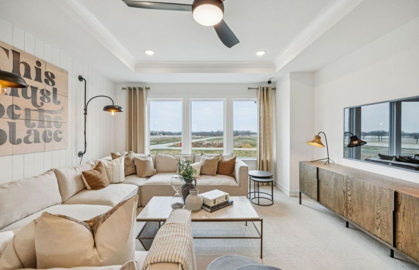 Spacious main living area with large windows