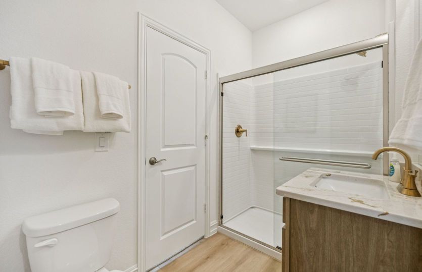 Secondary bathroom shown with optional shower