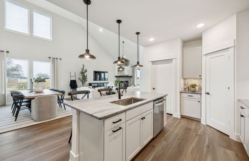 Open-concept living area with two-story ceilings