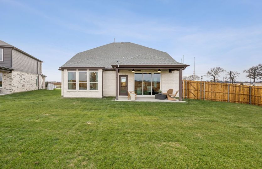 Spacious backyard with covered patio