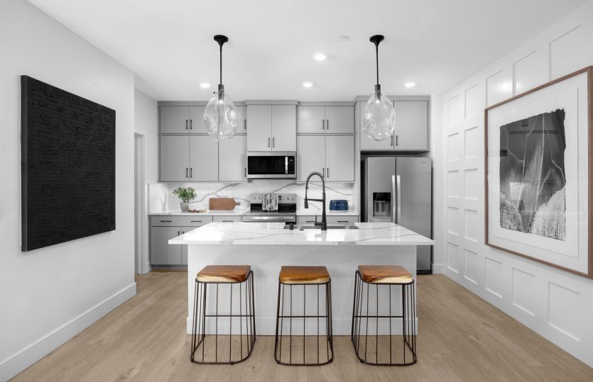 Kitchen with central island open to main living spaces