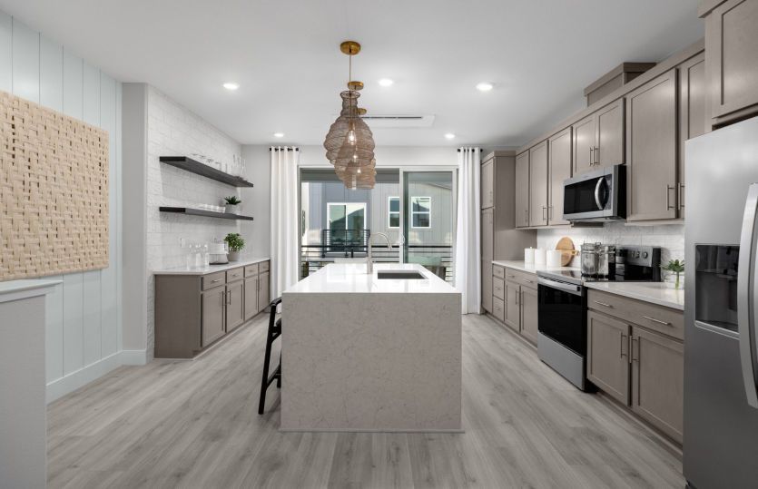 Kitchen leading into gathering room