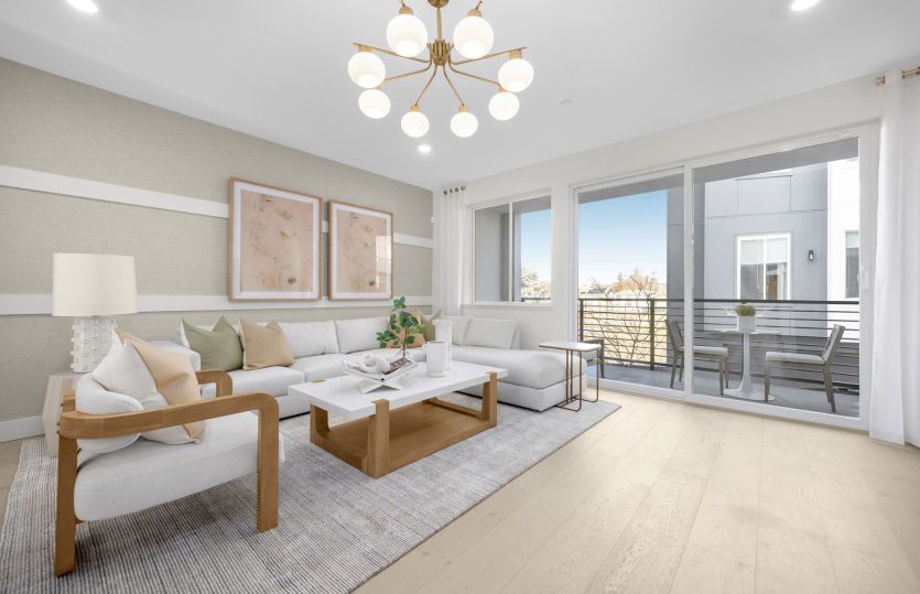 Gathering room with sliding glass door and balcony access