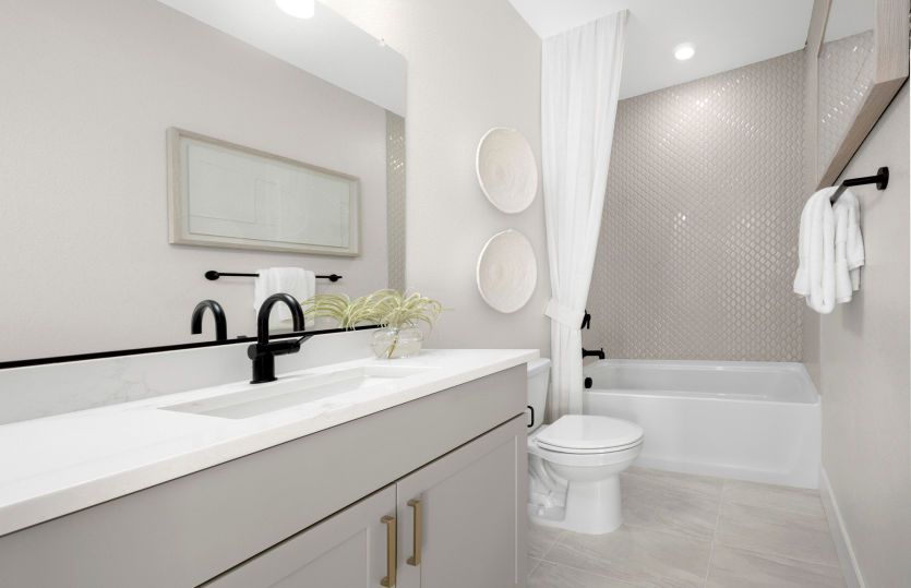 Bathroom 3 with tile surround and a tub shower