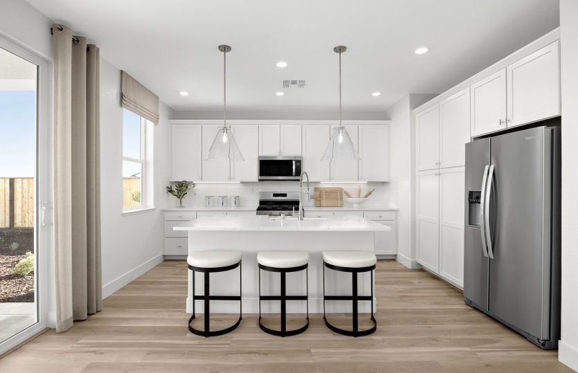 Kitchen with large central island and ample cabinetry