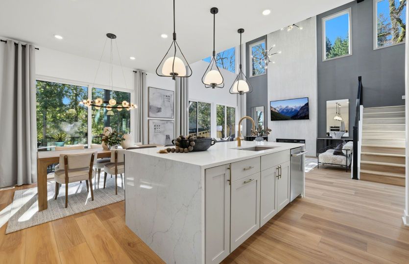 Kitchen overlooks cafe and gathering room