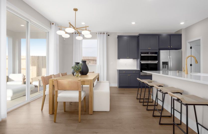 Kitchen and dining area with access to the backyard