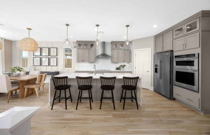 Welcoming kitchen with large waterfall edge island
