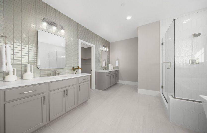 Grand owner's bath with double vanity, glass walk-in shower and freestanding tub
