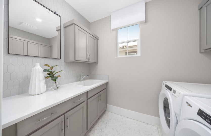 Laundry with built in cabinetry