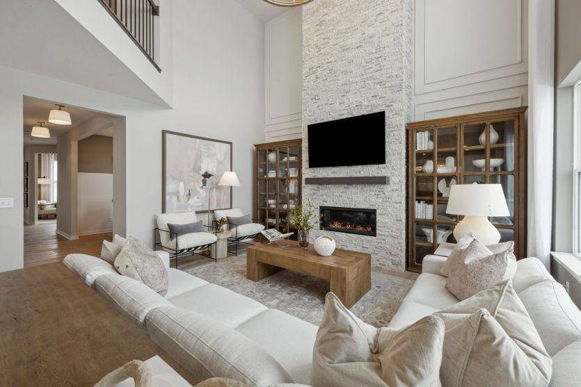 Elevate your living experience with this breathtaking two-story gathering room.